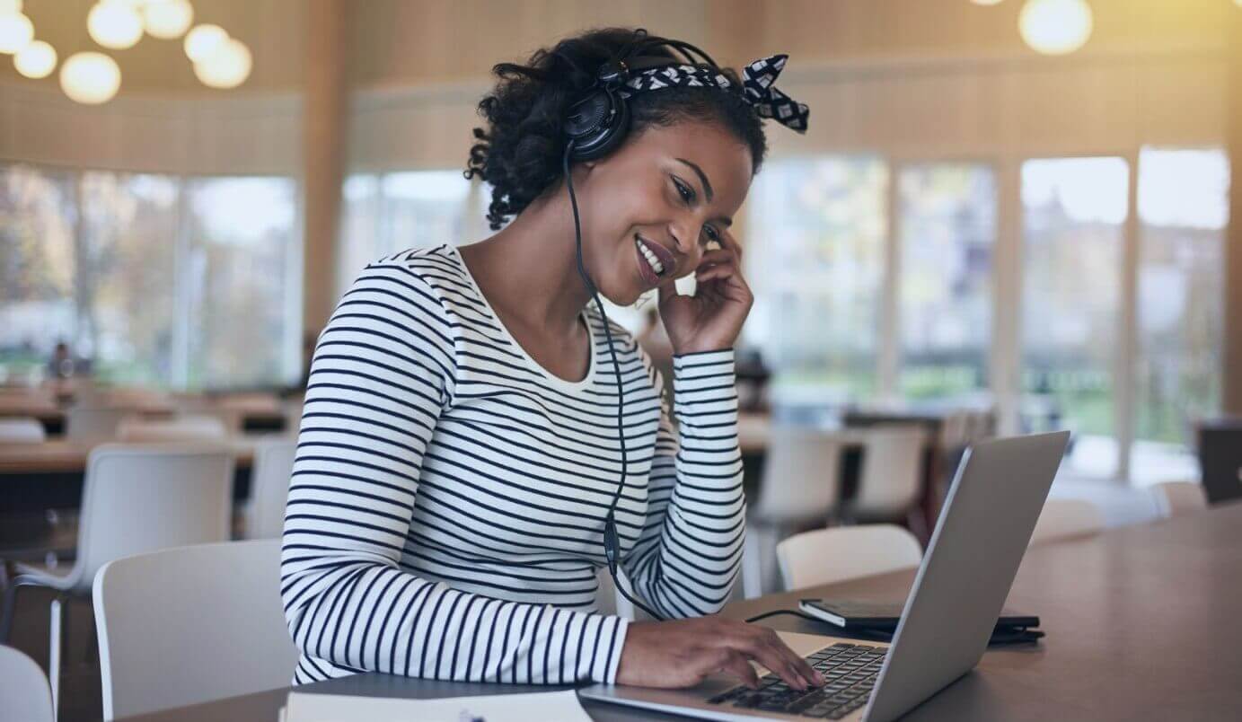 A professional working from home while pursuing an online degree.